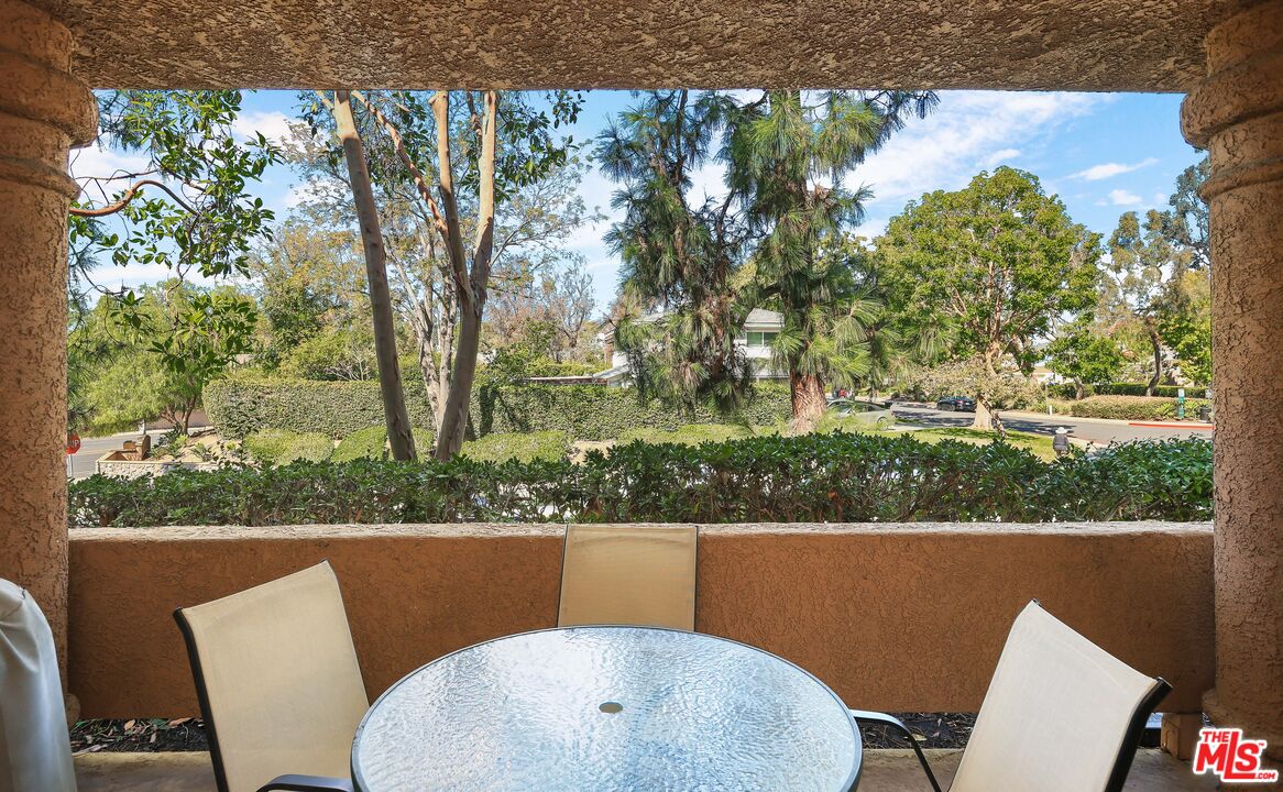 24193 Harbor Ridge Lane, Unit 81 Lake Forest, CA 92630 - Photo 25 of 43 a view of a porch with furniture and a yard