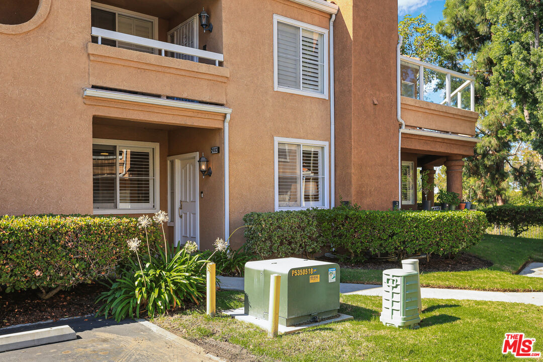 24193 Harbor Ridge Lane, Unit 81 Lake Forest, CA 92630 - Photo 27 of 43 a front view of a house with garden