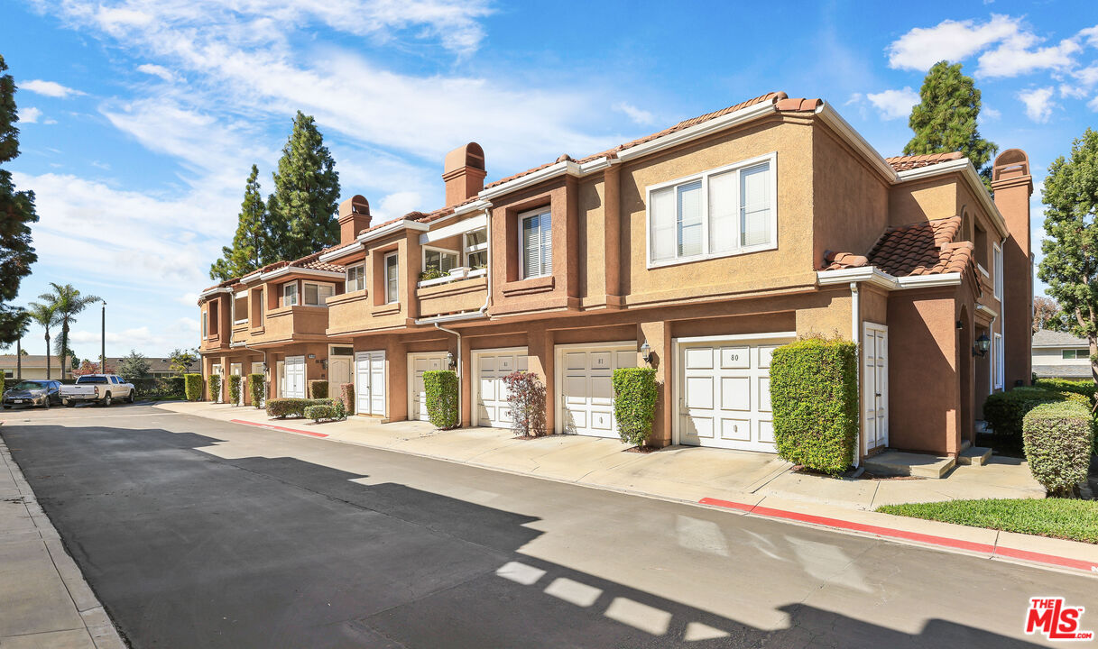 24193 Harbor Ridge Lane, Unit 81 Lake Forest, CA 92630 - Photo 33 of 43 a front view of a building with street view