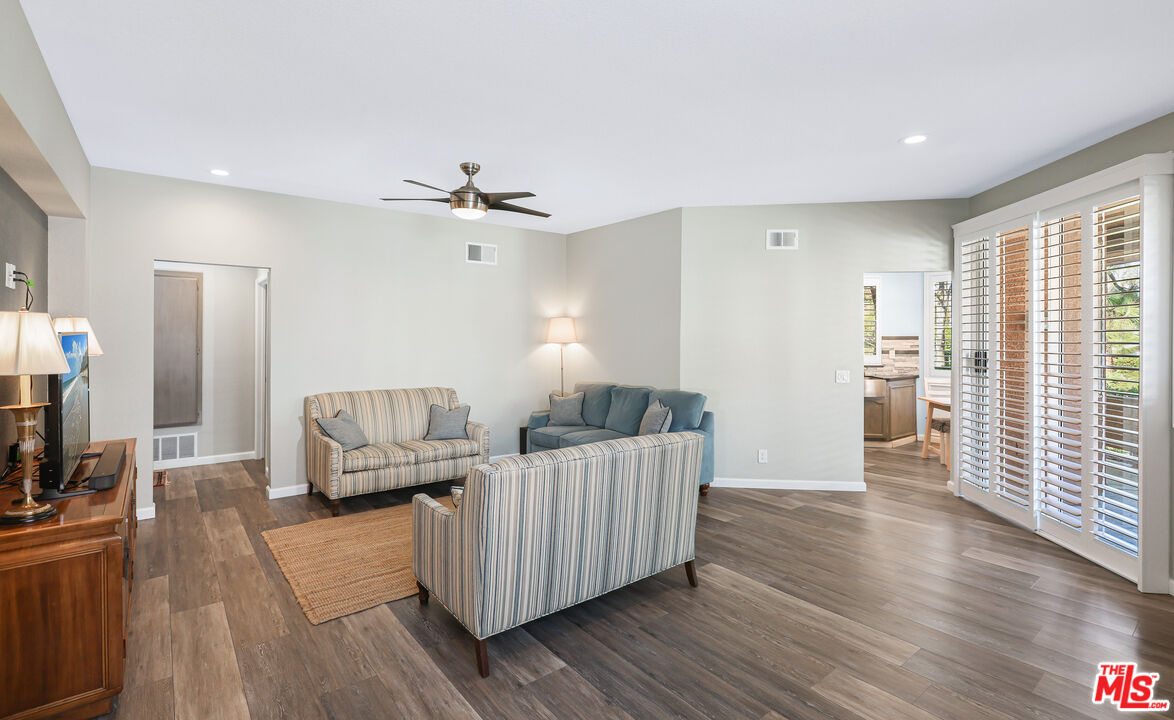 24193 Harbor Ridge Lane, Unit 81 Lake Forest, CA 92630 - Photo 4 of 43 a living room with furniture and wooden floor