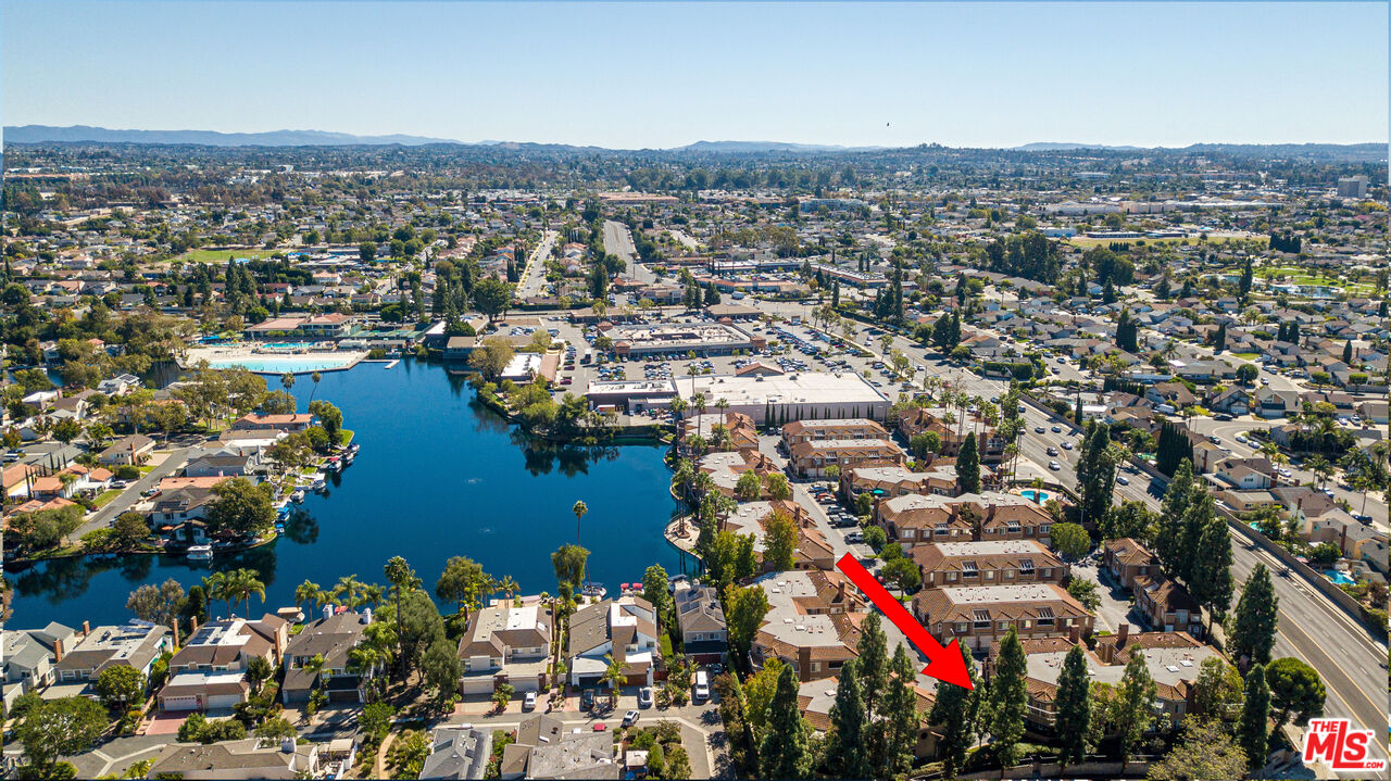 24193 Harbor Ridge Lane, Unit 81 Lake Forest, CA 92630 - Photo 42 of 43 an aerial view of lake and residential houses with outdoor space