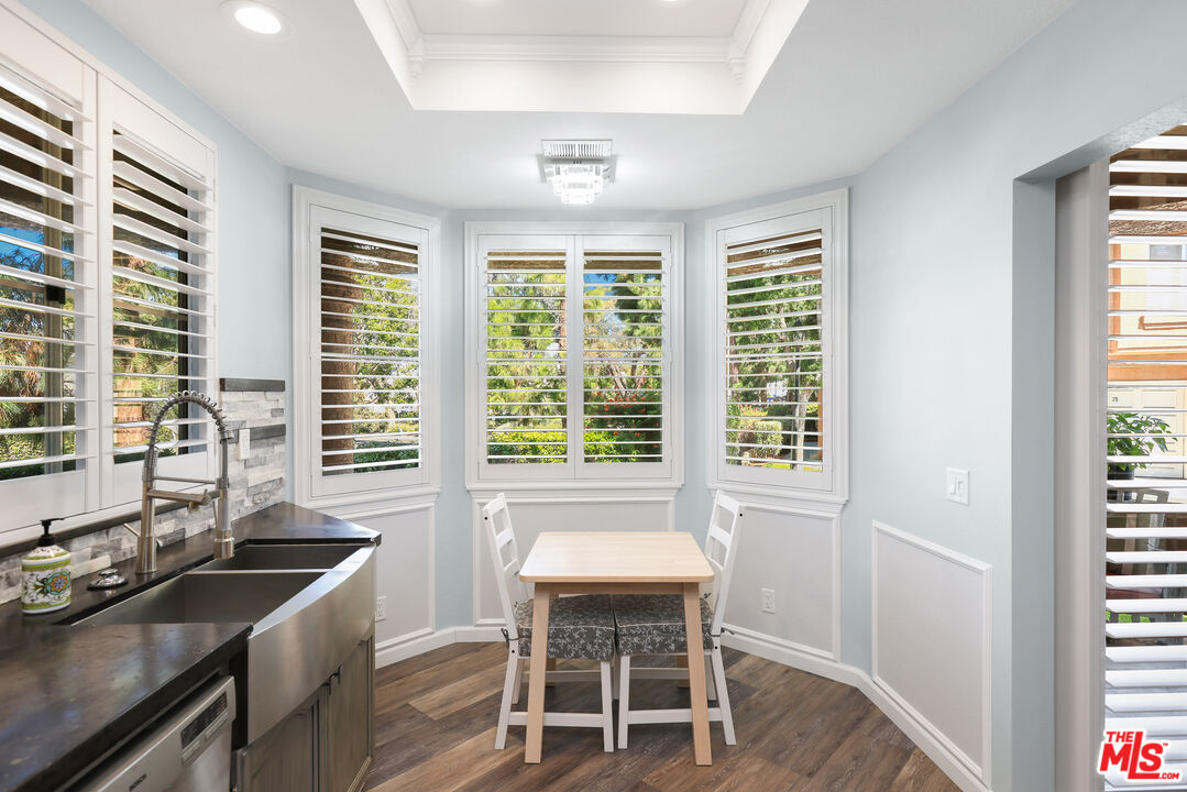 24193 Harbor Ridge Lane, Unit 81 Lake Forest, CA 92630 - Photo 8 of 43 a kitchen with a table chairs and a sink