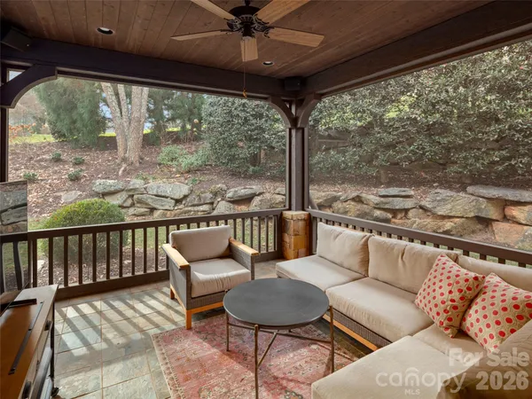 a balcony with furniture and outdoor view