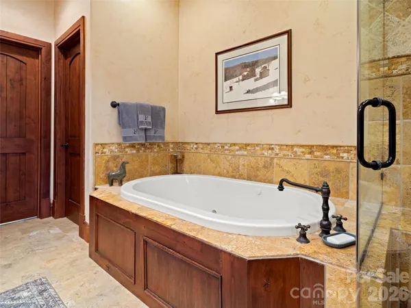 a bathroom with a tub and a sink