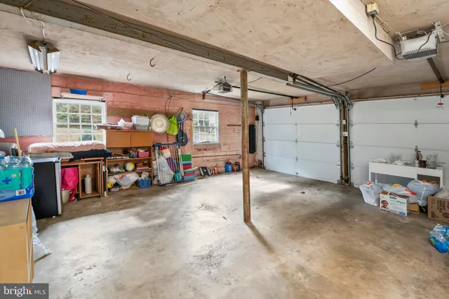 a view of a porch with a table and chairs