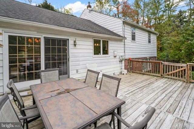 a view of a wooden deck with furniture