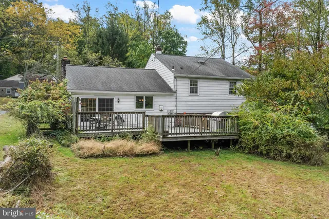 a view of a house with backyard porch and sitting area