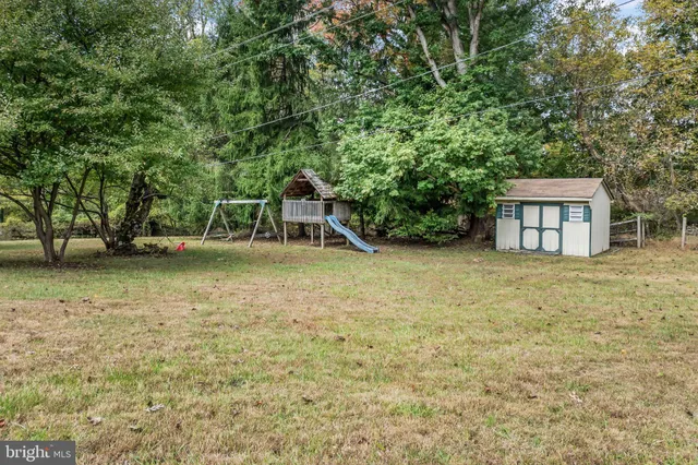 an aerial view of residential house with outdoor space