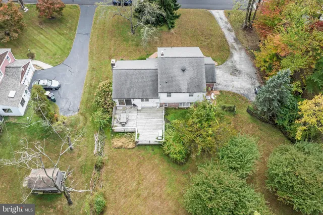 an aerial view of residential house with outdoor space and swimming pool