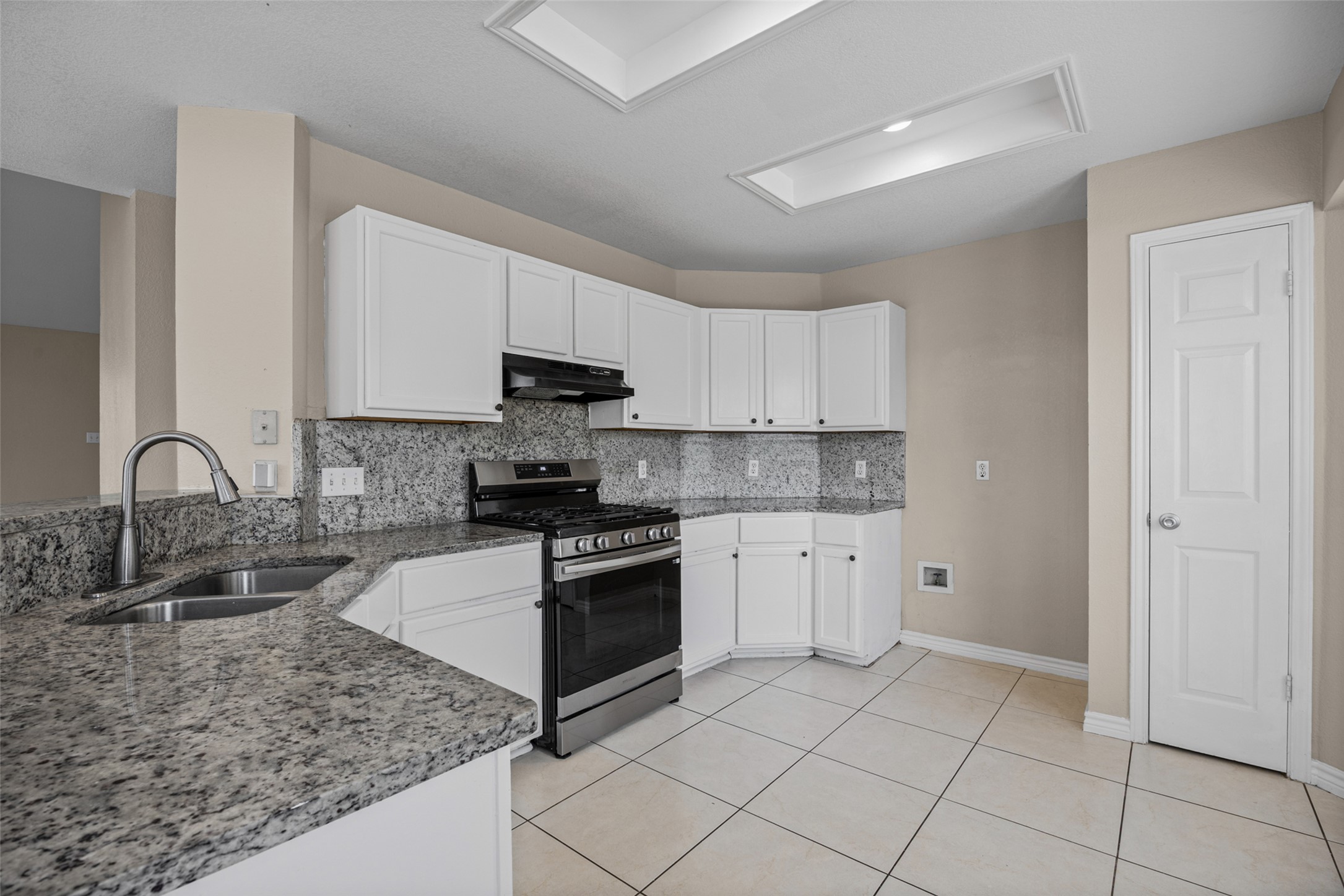 2432 Roundabout Lane Round Rock, TX 78664 - Photo 7 of 22 Culinary delights await in this bright kitchen with granite countertops and modern appliances.