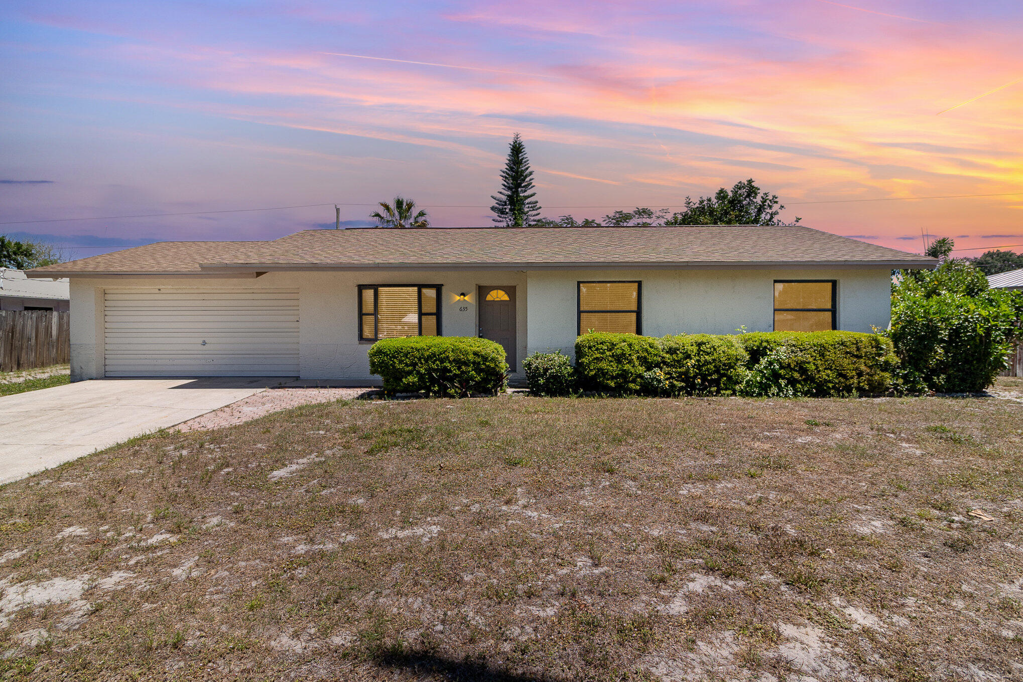 635 Croton Road Melbourne, FL 32935 - Photo 1 of 22 front view of a house with a yard