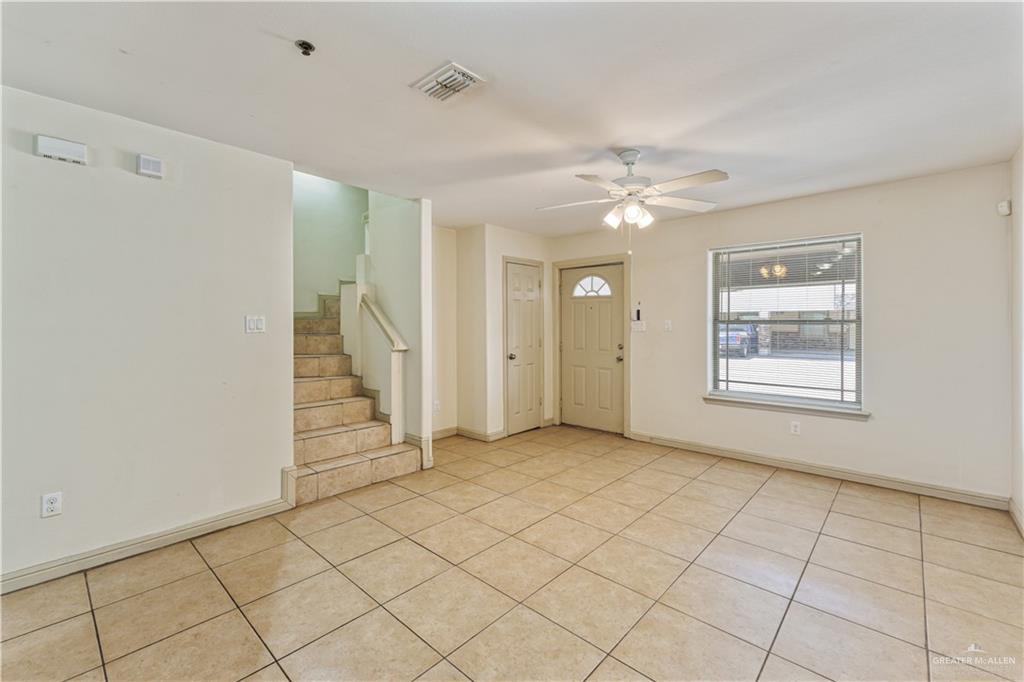 1500 Humming Bird Court, Unit 14 Pharr, TX 78577 - Photo 3 of 26 wooden floor in an empty room with a window