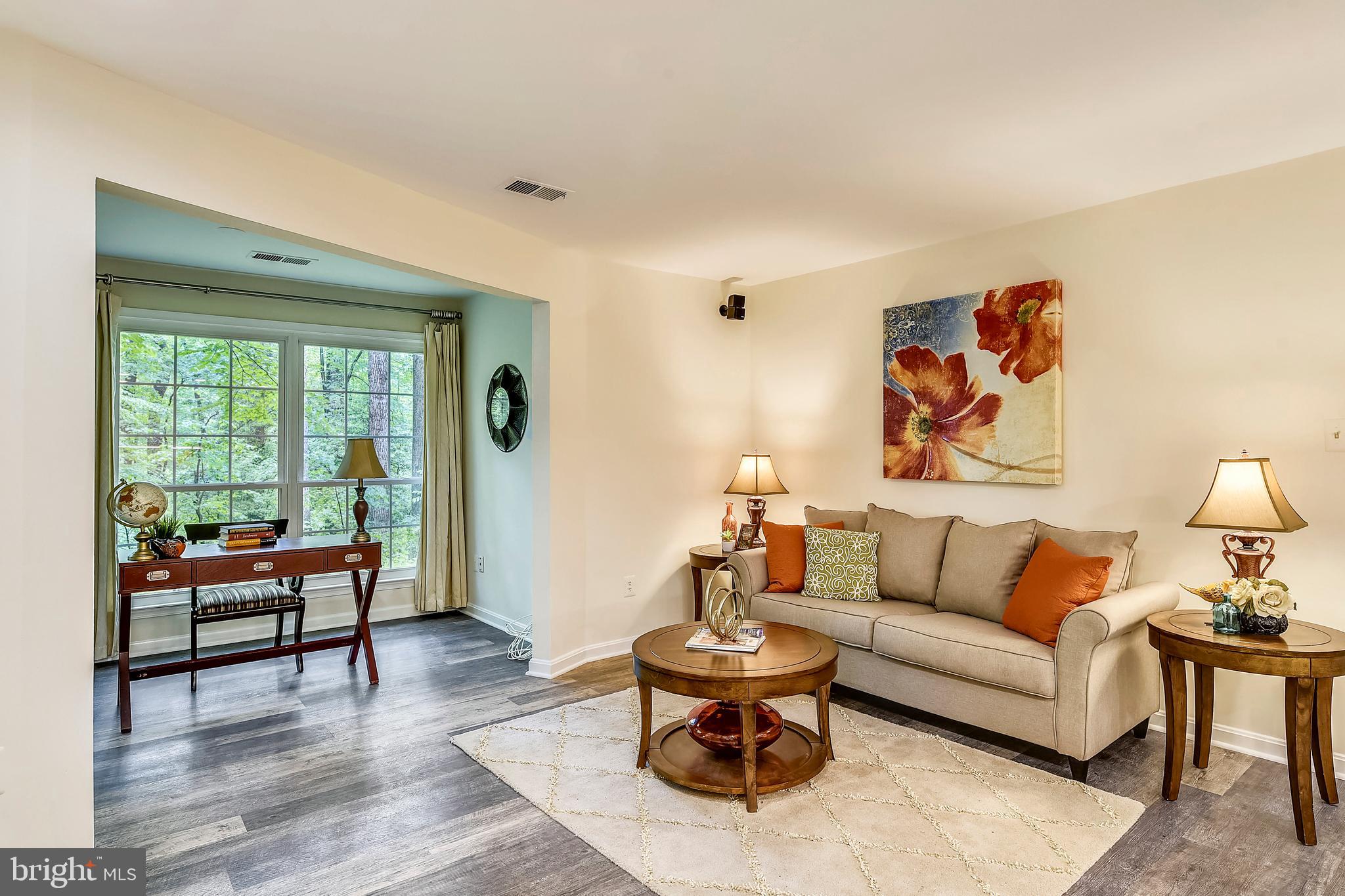 2241 Lovedale Lane, Unit B Reston, VA 20191 - Photo 13 of 27 a living room with furniture and wooden floor