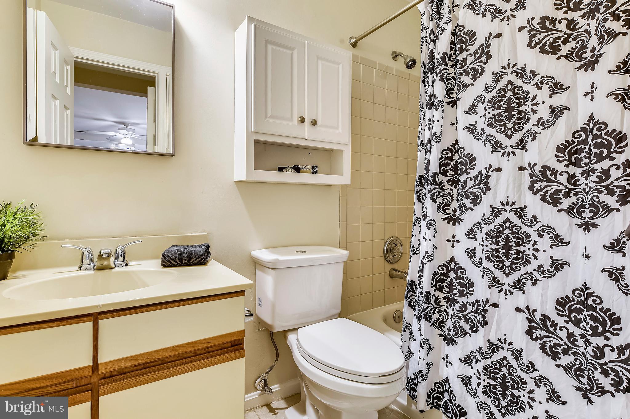2241 Lovedale Lane, Unit B Reston, VA 20191 - Photo 16 of 27 a bathroom with a toilet and a sink