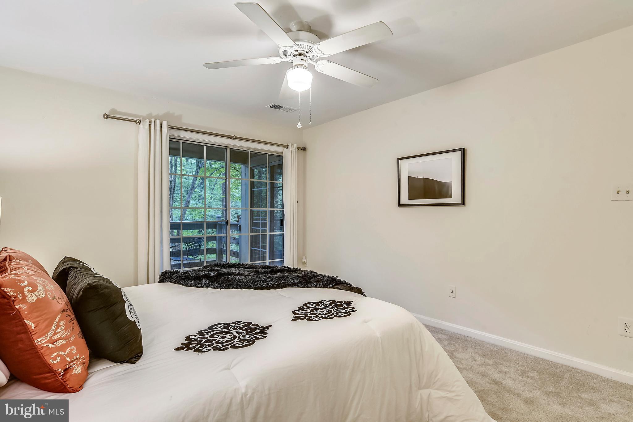 2241 Lovedale Lane, Unit B Reston, VA 20191 - Photo 18 of 27 a bedroom with a large bed and a window