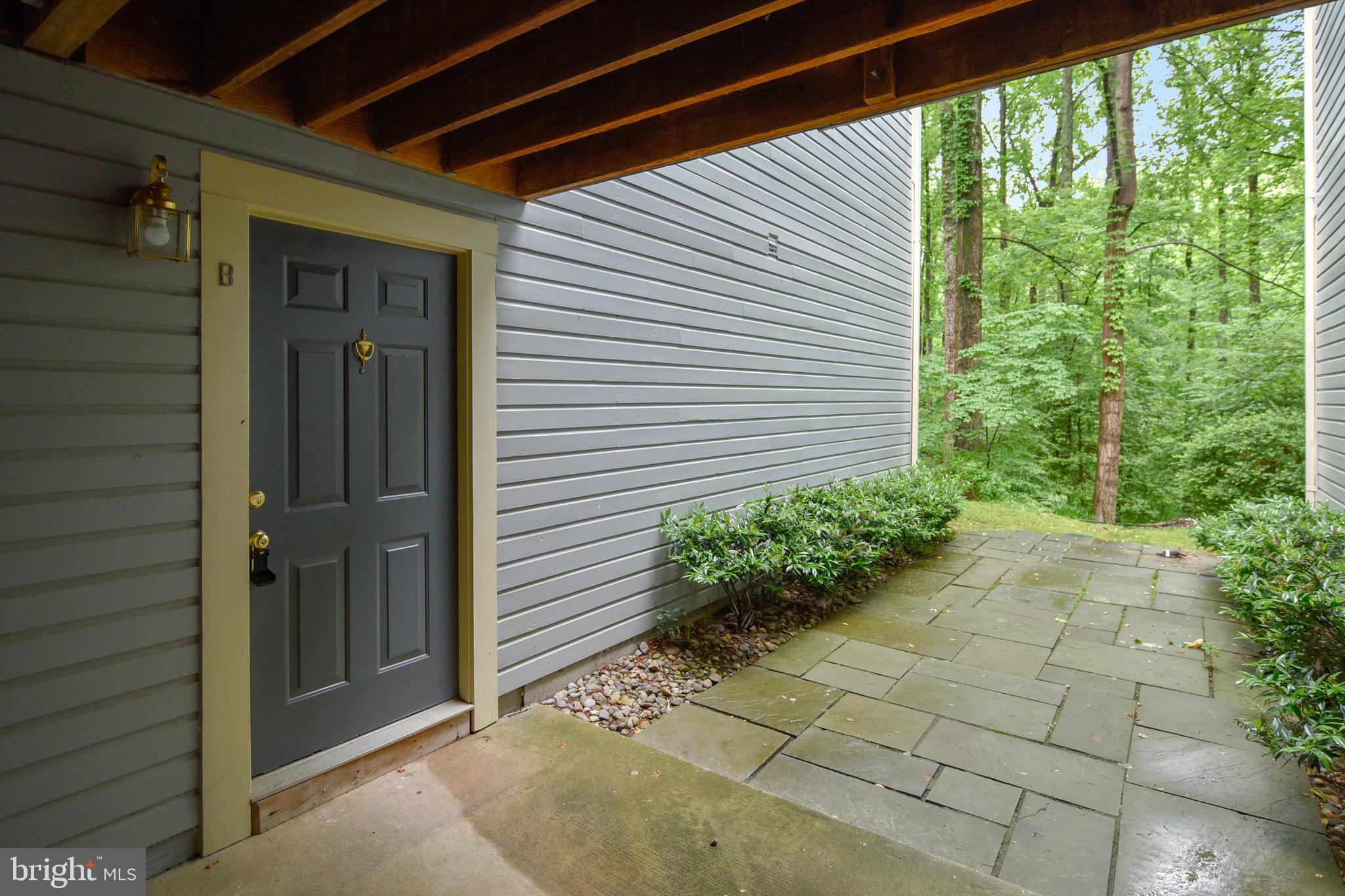 2241 Lovedale Lane, Unit B Reston, VA 20191 - Photo 24 of 27 a potted plant sitting in front of a house