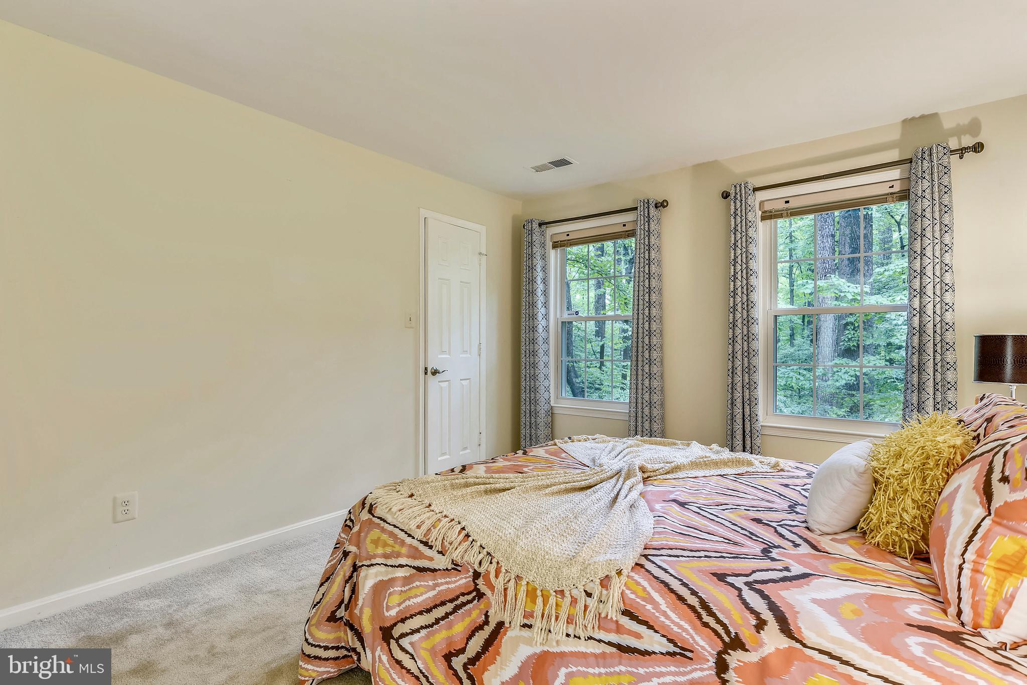 2241 Lovedale Lane, Unit B Reston, VA 20191 - Photo 6 of 27 a bedroom with a bed and a window