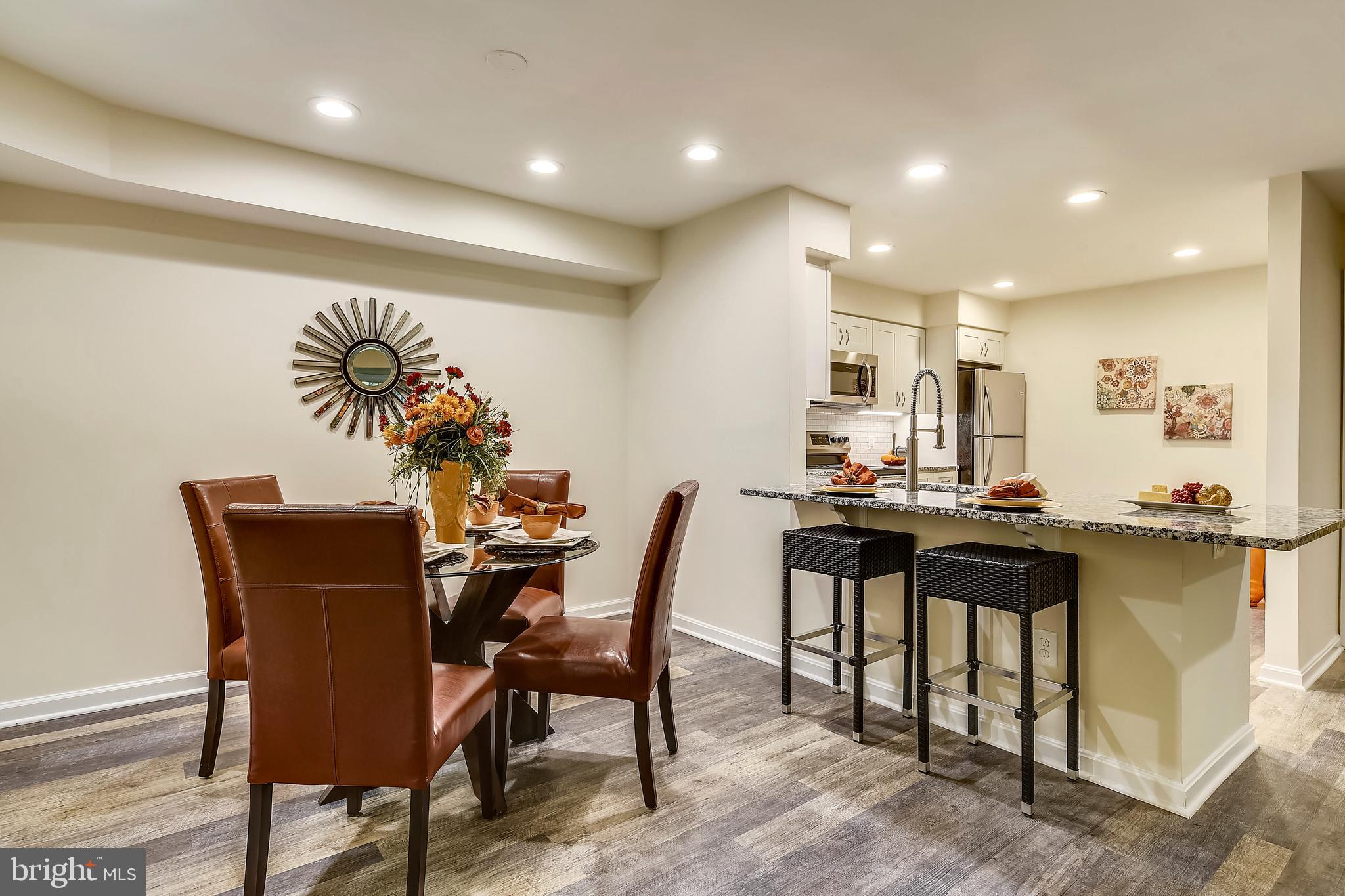 2241 Lovedale Lane, Unit B Reston, VA 20191 - Photo 9 of 27 a view of a dining room with furniture
