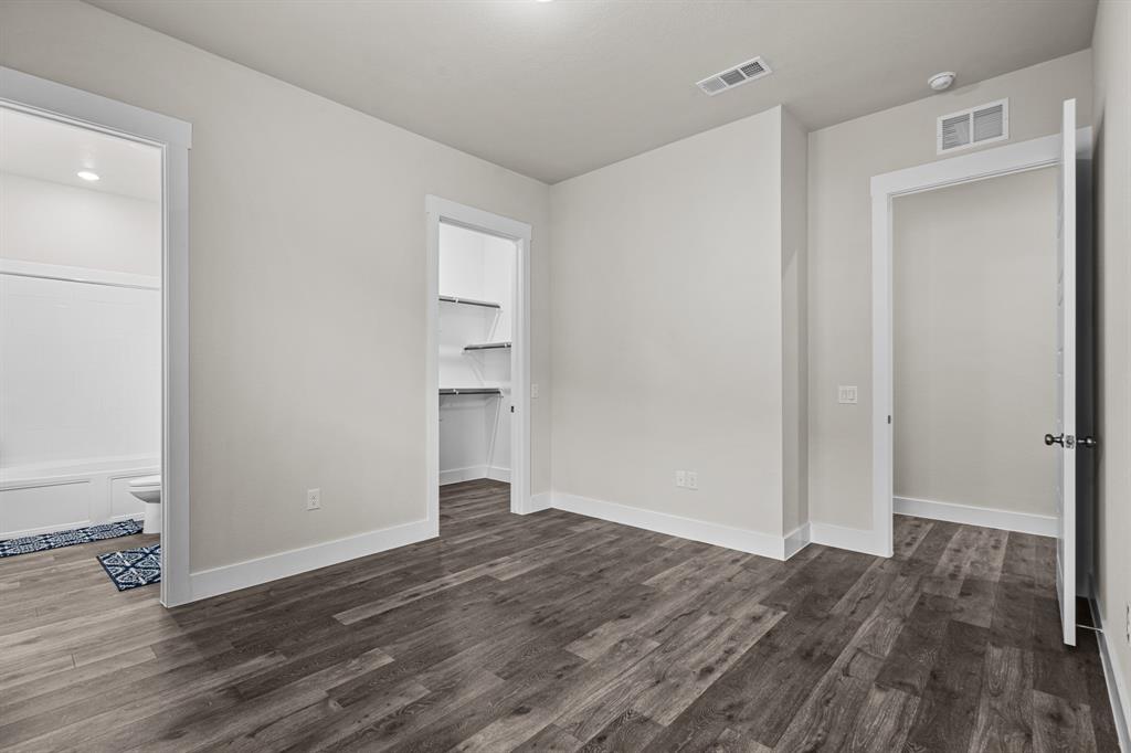 3284 Ganzer Road West, Unit 1107A Denton, TX 76207 - Photo 19 of 37 a view of empty room with wooden floor