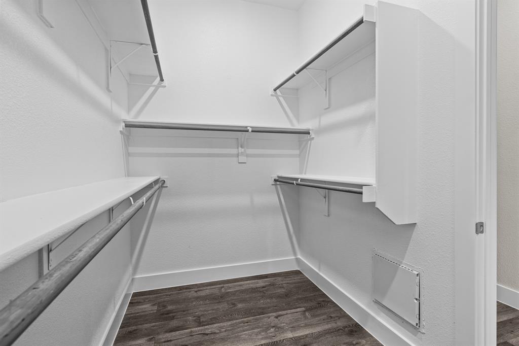 3284 Ganzer Road West, Unit 1107A Denton, TX 76207 - Photo 26 of 37 a view of walk in closet with empty racks
