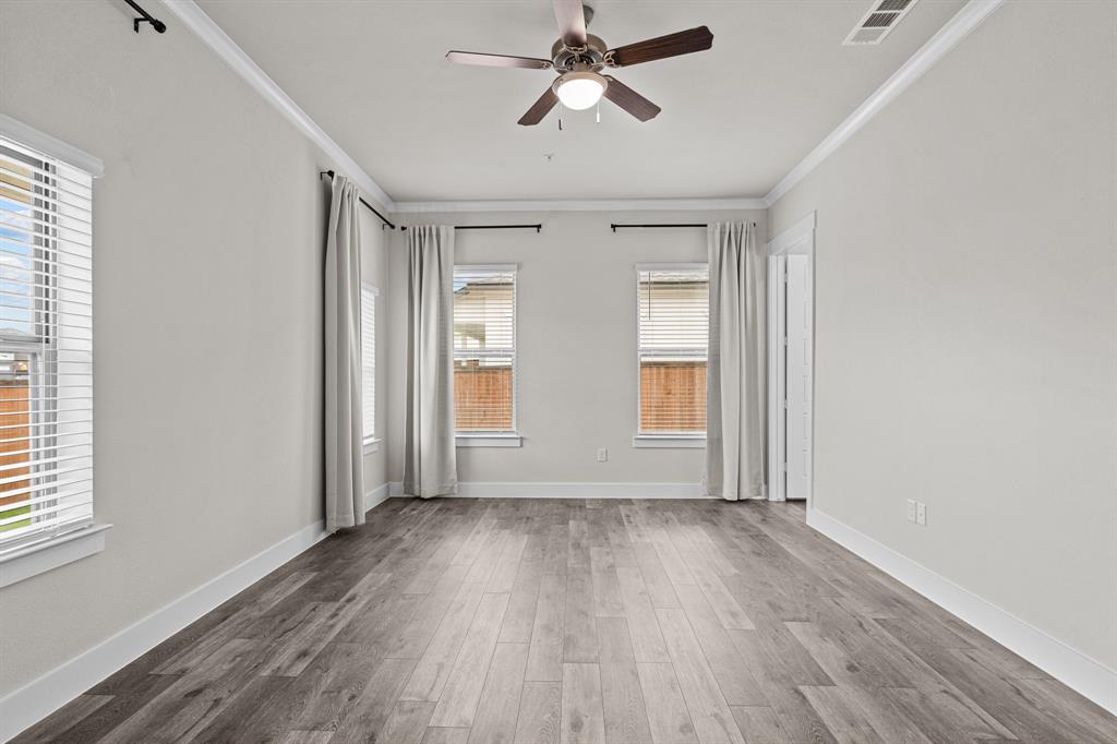 3284 Ganzer Road West, Unit 1107A Denton, TX 76207 - Photo 28 of 37 a view of empty room with wooden floor and fan