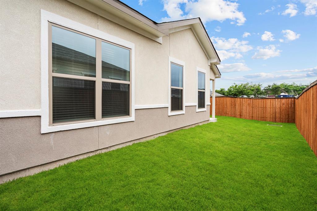 3284 Ganzer Road West, Unit 1107A Denton, TX 76207 - Photo 37 of 37 a view of back yard of the house with green space