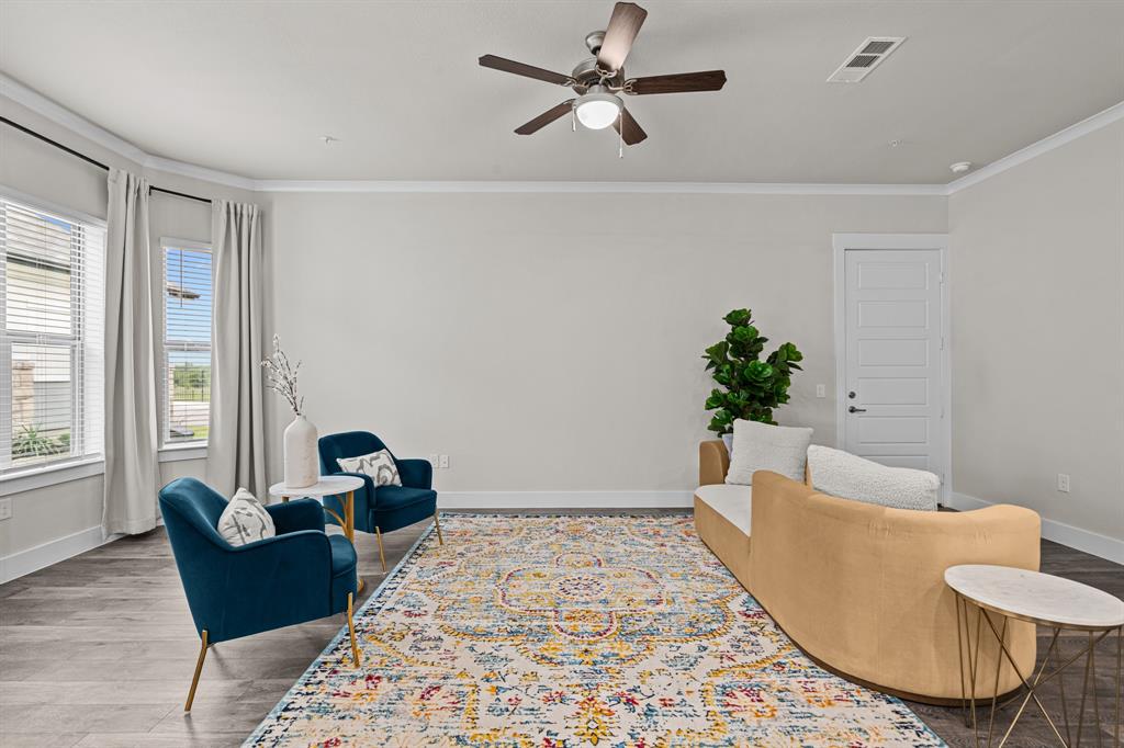 3284 Ganzer Road West, Unit 1107A Denton, TX 76207 - Photo 9 of 37 a living room with furniture and a potted plant