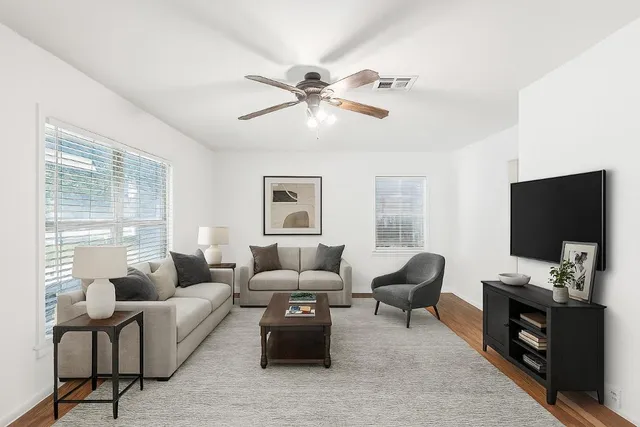 a living room with furniture and a flat screen tv