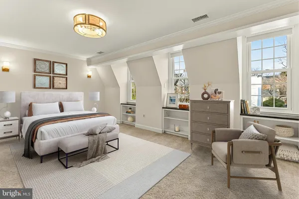 an empty room with windows and ceiling fan