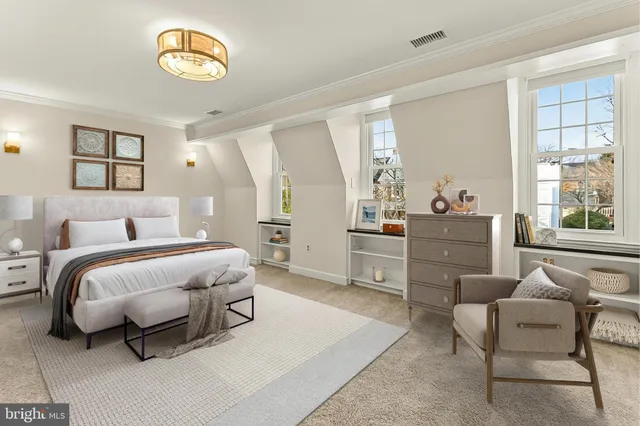 an empty room with windows and ceiling fan