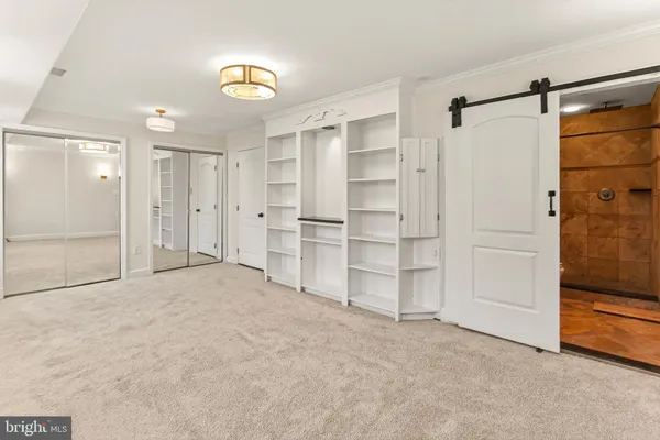 a bathroom with a granite countertop toilet sink and shower