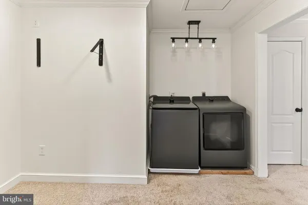 a bathroom with a sink a toilet a mirror and shower