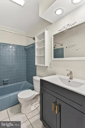 an empty room with closet and a chandelier fan
