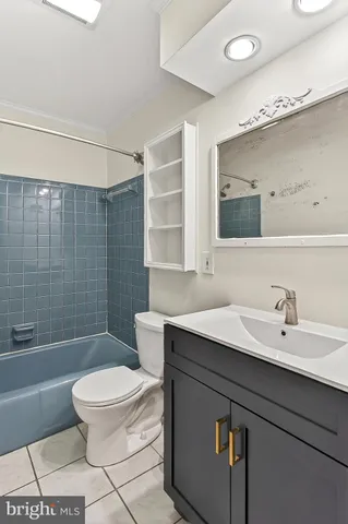 an empty room with closet and a chandelier fan