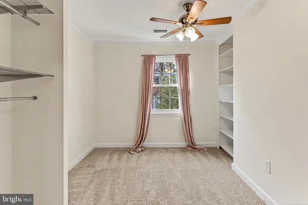 a view of an entryway with wooden floor and staircase