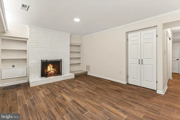 a white toilet sitting next to a bathroom sink