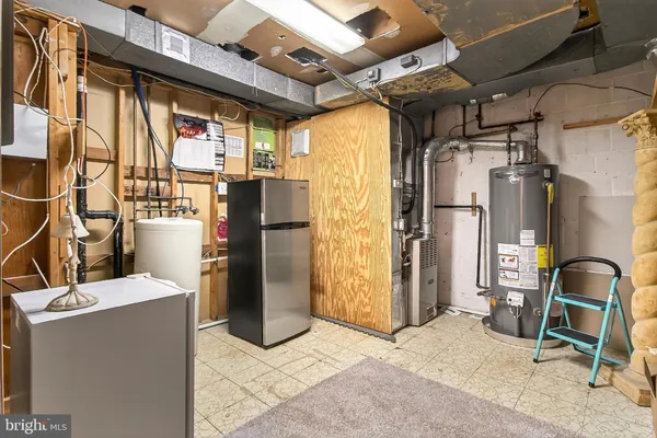 a front view of a house with a garden and patio