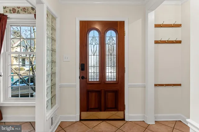 a view of a house with wooden fence