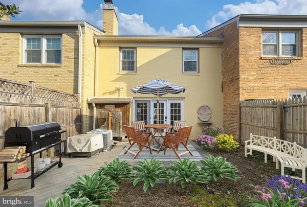 a view of a house with wooden fence