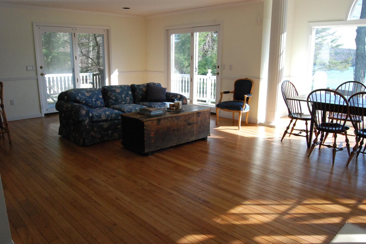 151 Hupi Road Monterey, MA 01245 - Photo 14 of 31 a living room with furniture wooden floor and a floor to ceiling window