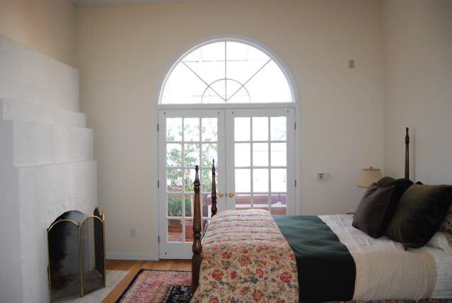 151 Hupi Road Monterey, MA 01245 - Photo 20 of 31 a bedroom with a bed and a large window