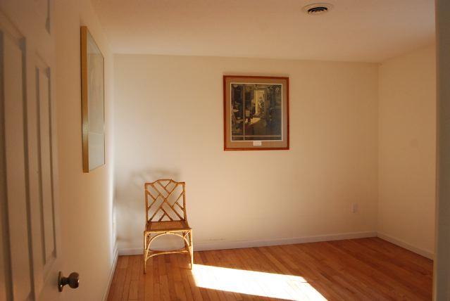 151 Hupi Road Monterey, MA 01245 - Photo 21 of 31 a room with a bench and a wooden floor