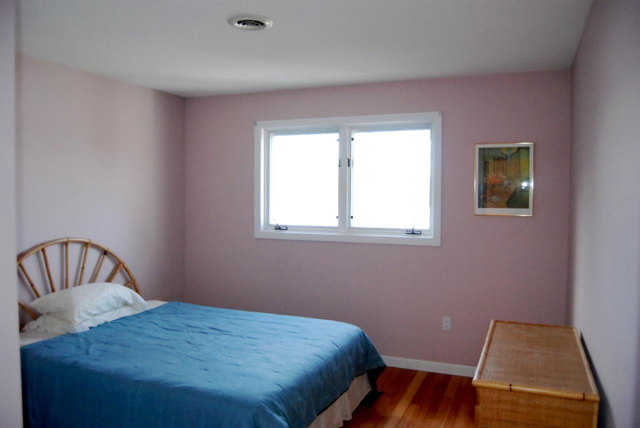 151 Hupi Road Monterey, MA 01245 - Photo 22 of 31 a bedroom with a bed and wooden floor