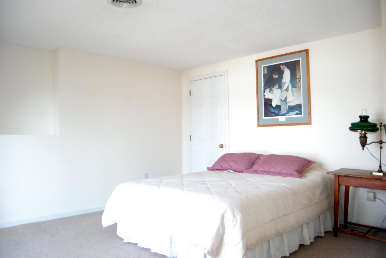 151 Hupi Road Monterey, MA 01245 - Photo 23 of 31 a bedroom with a bed and a painting on the wall