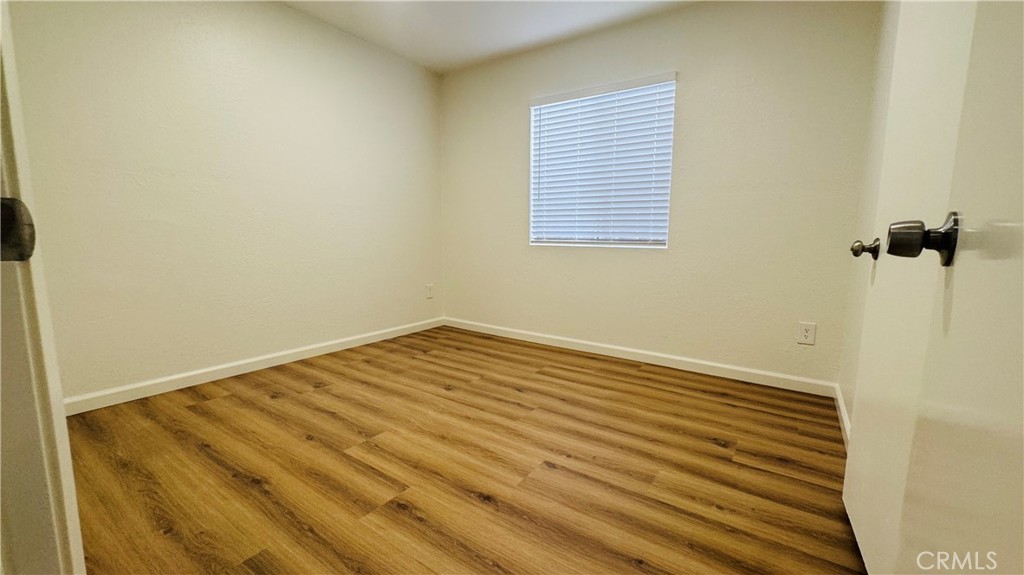 4628 Bird Farm Road Chino Hills, CA 91709 - Photo 12 of 16 a view of a room with wooden floor and a window