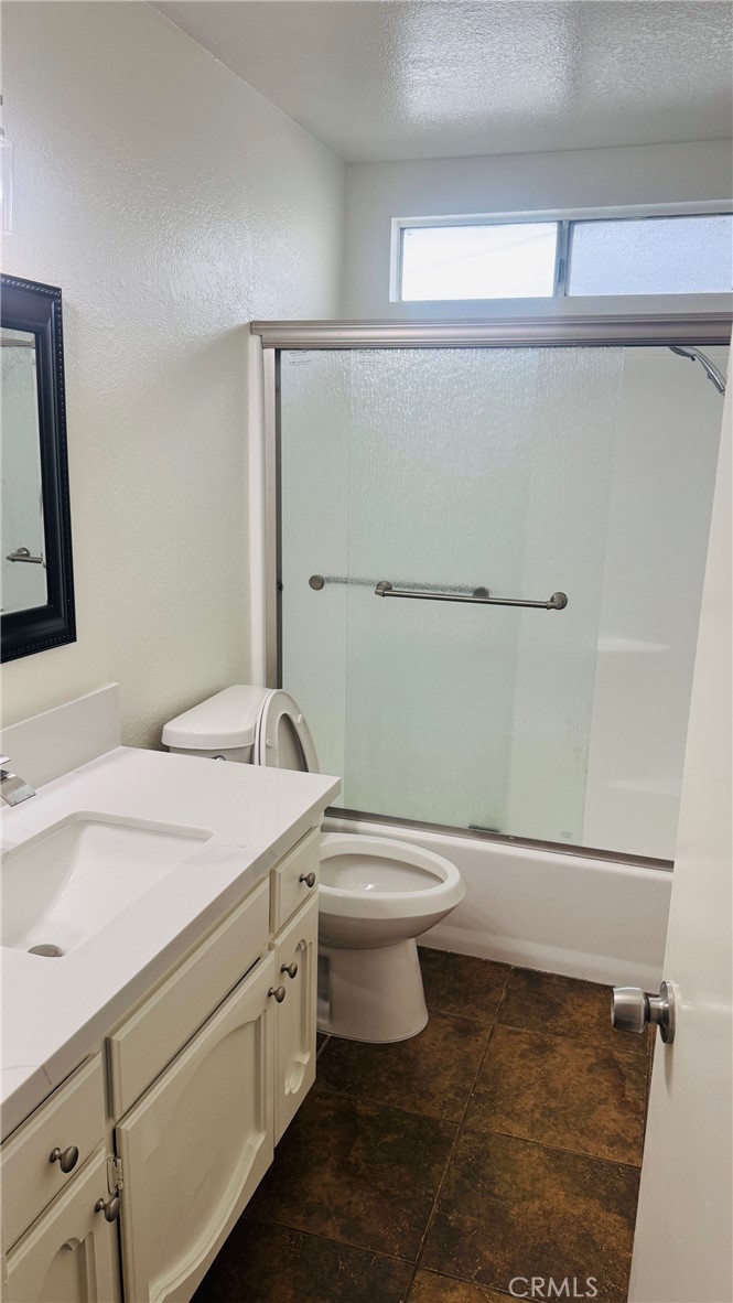 4628 Bird Farm Road Chino Hills, CA 91709 - Photo 13 of 16 a bathroom with a granite countertop toilet sink and mirror