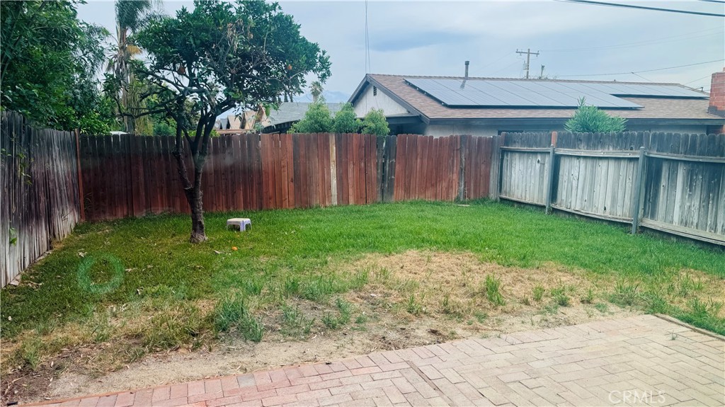 4628 Bird Farm Road Chino Hills, CA 91709 - Photo 16 of 16 a backyard of a house with lawn chairs plants and wooden fence