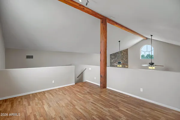 a kitchen with a stove a sink and a microwave