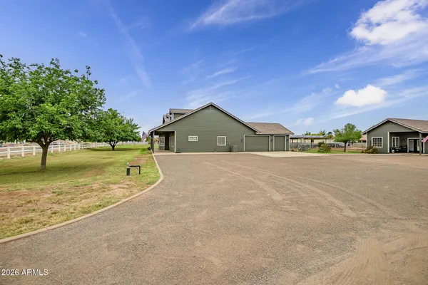 an aerial view of a house with a ocean view