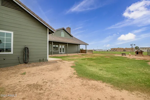 a view of a house with a big yard